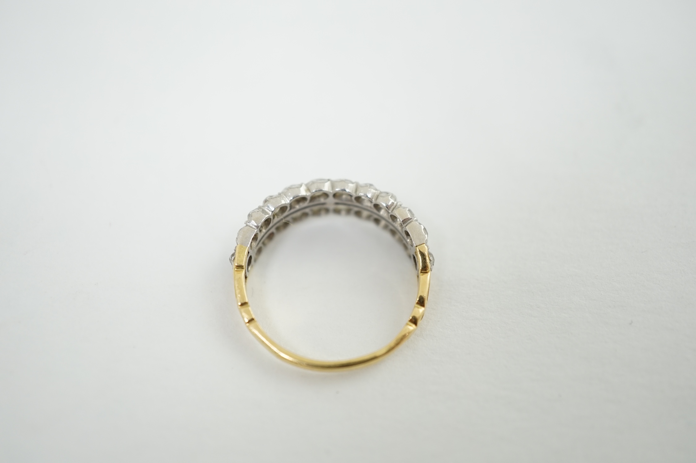 A late Victorian gold and two row old mine cut diamond cluster set half hoop ring